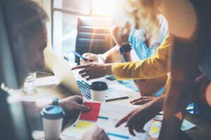 Young Group Coworkers Making Great Business Decisions.Marketing Team Discussion Corporate Work Concept Studio.New Startup Creative Idea Presentation Laptop.People Working Wood Table Documents.Blurred., Orlen
